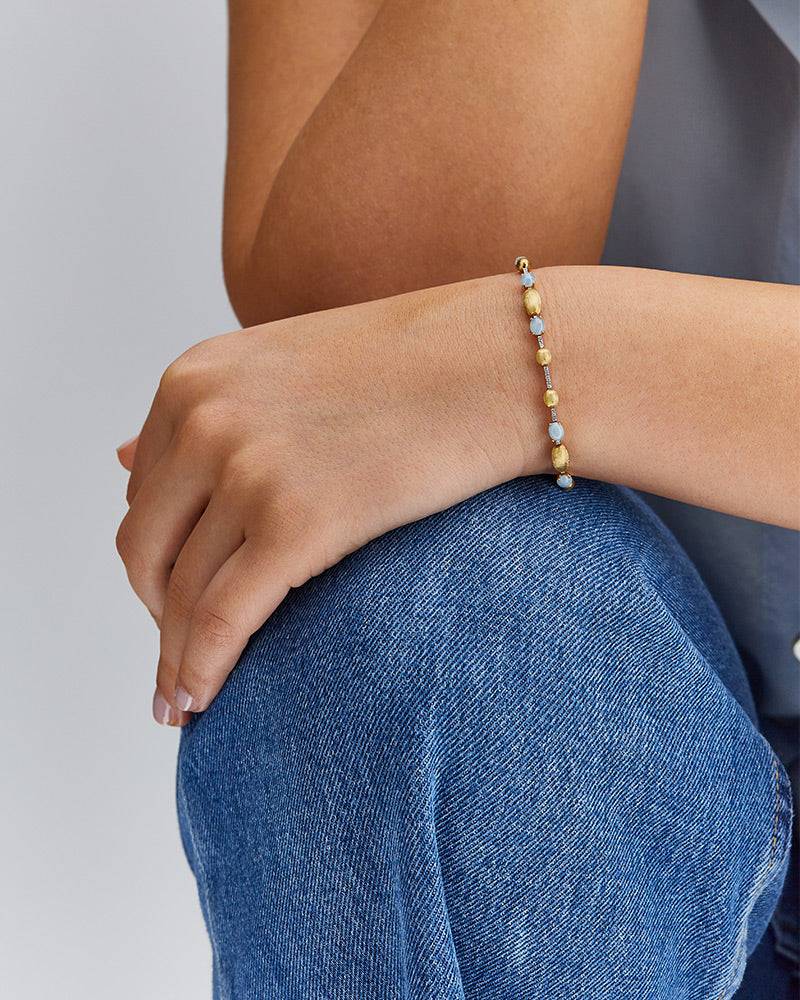 Nanis Bracciale tennis "DANCING AZURE" in oro, diamanti e acquamarina – Nanis Italian Jewels Presa