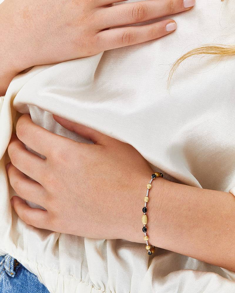 Nanis Bracciale tennis "DANCING MYSTERY BLACK" in oro, diamanti e onice nero – Nanis Italian Jewels Vendita